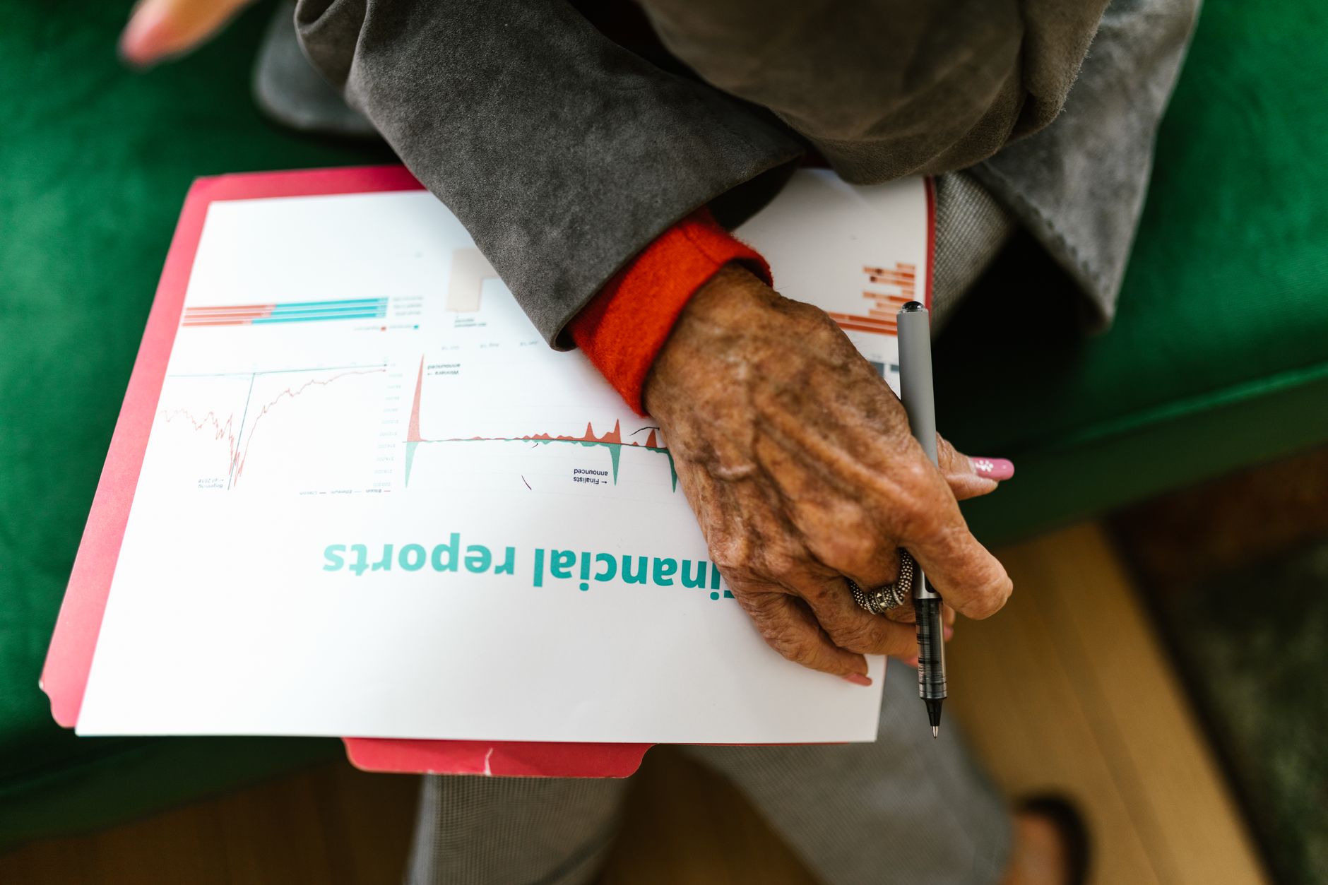 Senior legal advisor studying corporate documents in Ginza office